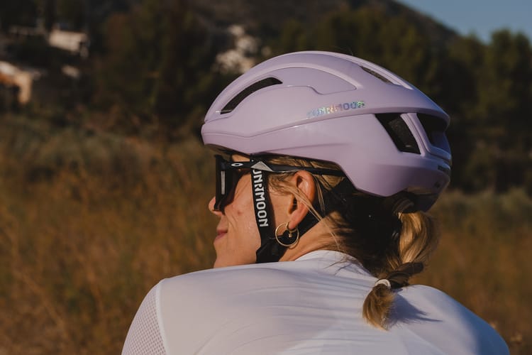 Women in a cycling helmet for safety in the sun by Sunrimoon